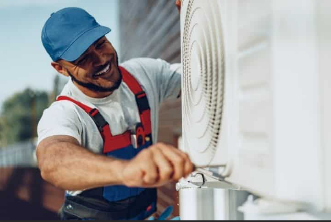 HVAC Technician performing repairs on Air Conditioning Unit In Salt Lake Valley